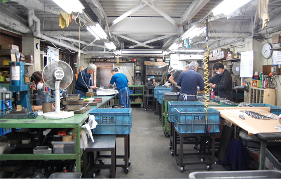 株式会社日進工機