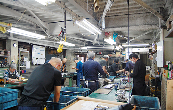 株式会社日進工機